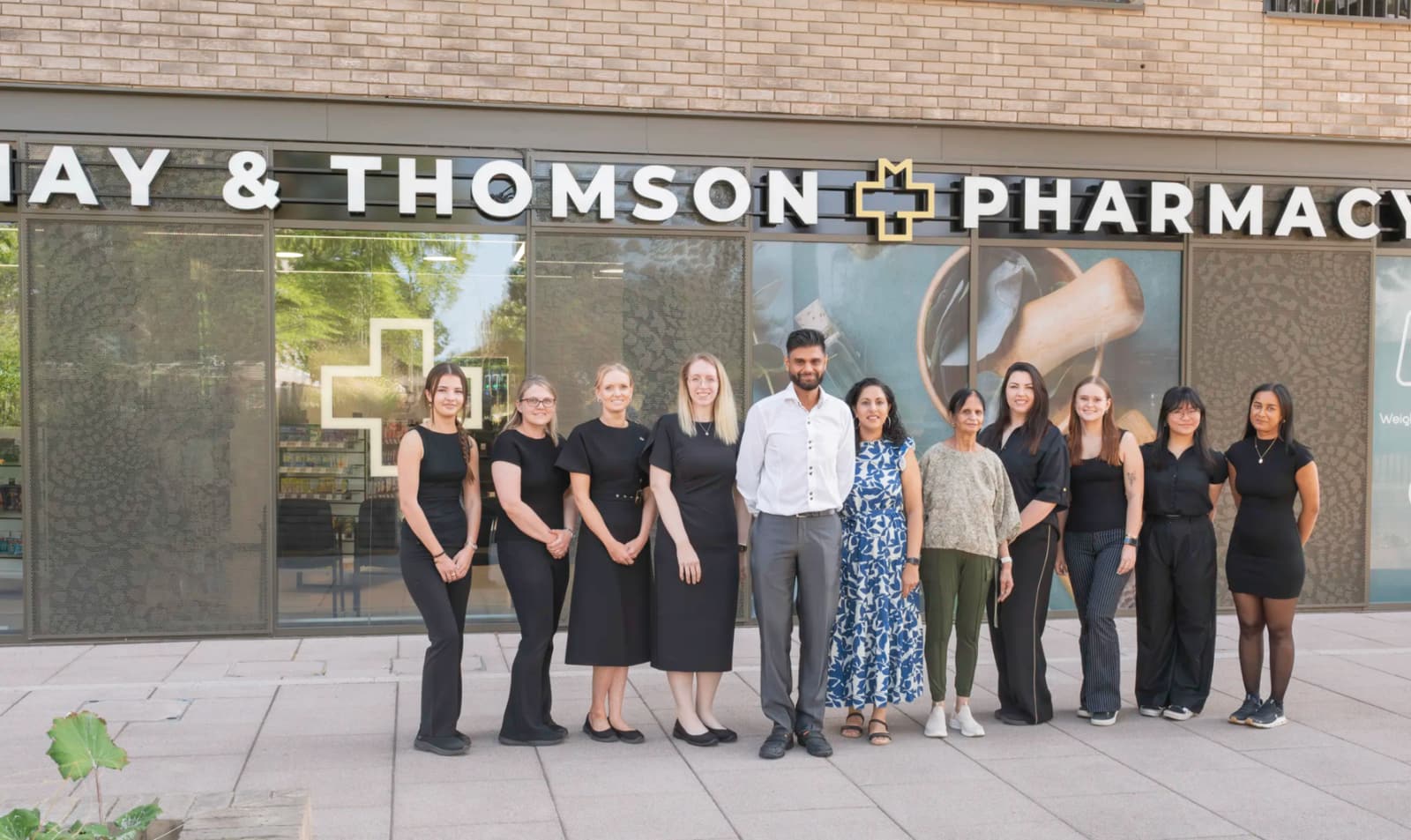 May & Thomson Pharmacy team outside the pharmacy