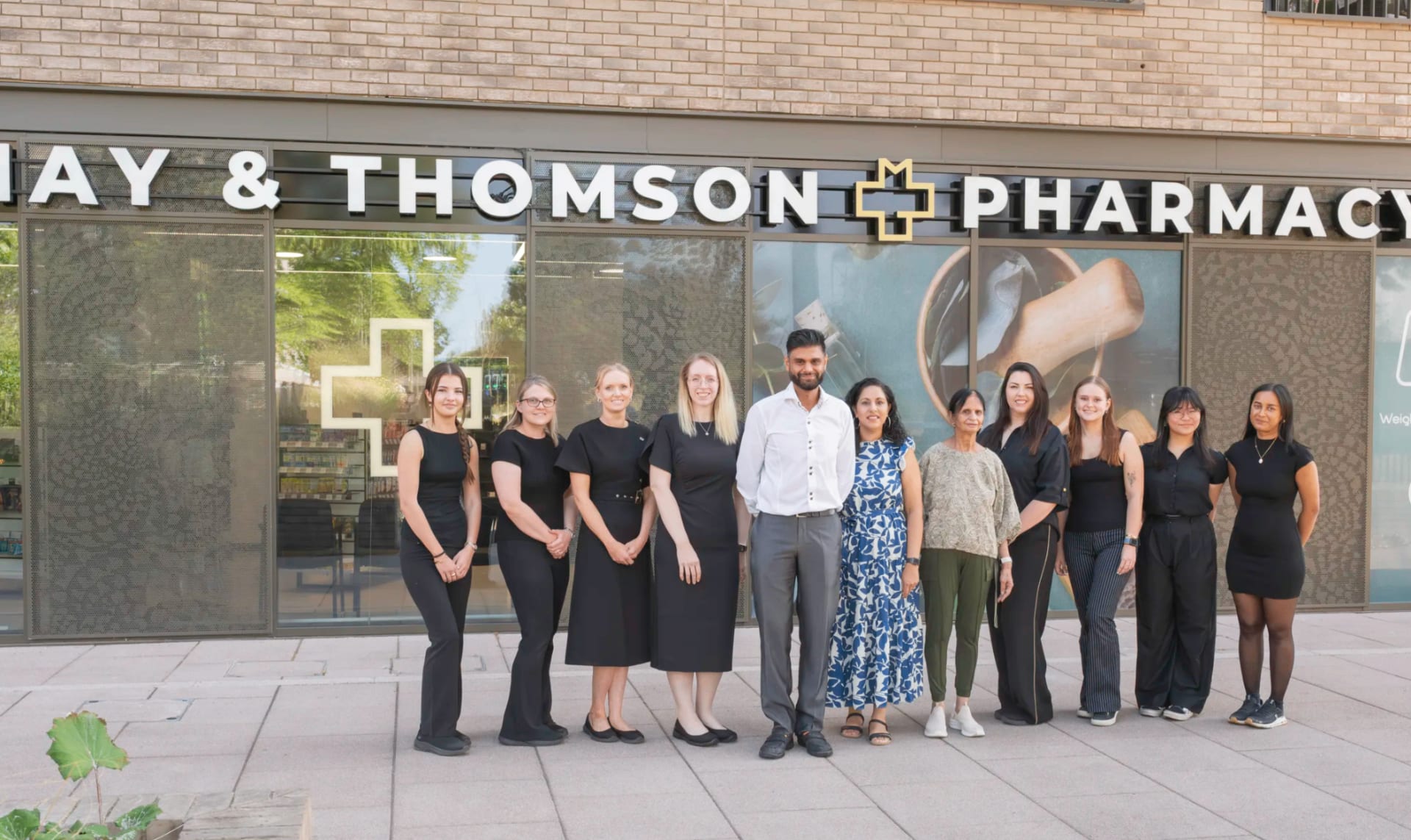 May & Thomson Pharmacy team outside the pharmacy